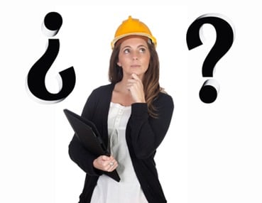 Young engineer with pensive face and security helmet 